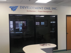 Development One, Inc Santa Ana: Mounted Acrylic W/ Vinyl Print & Painted Acrylic Letters by Focal Point Costa Mesa