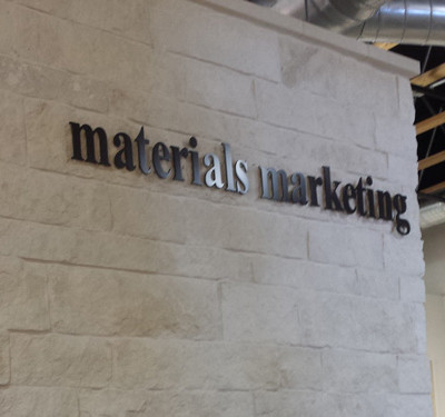 Materials Marketing: Interior Lobby Sign Pin Mounted with Spacers by Focal Point Costa Mesa