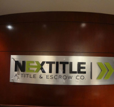 Nextitle: Brushed Alum backing W/ Acrylic Lettering by Focal Point Costa Mesa